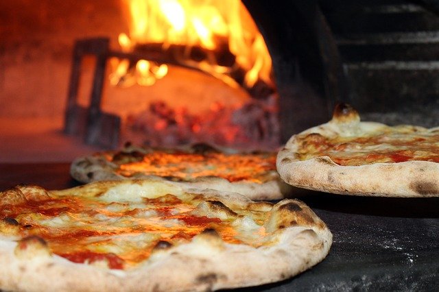 the classic pizza is cooked in a wood oven